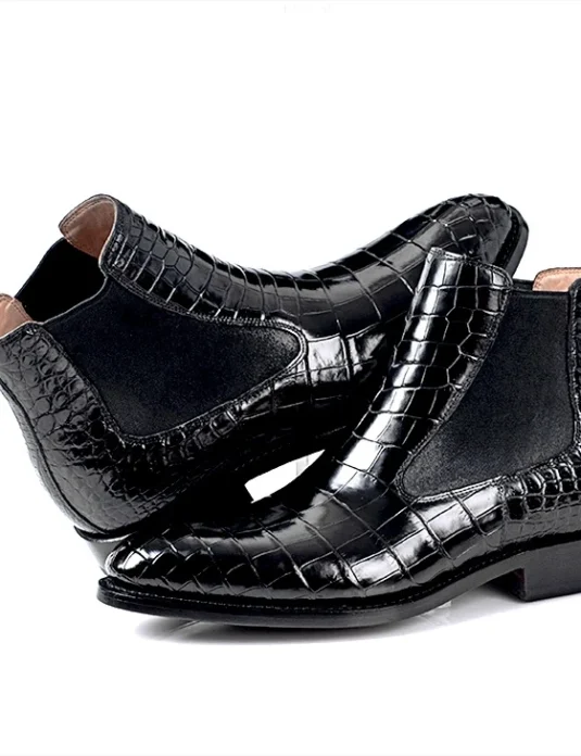 Black alligator leather chelsea boots with glossy square-pattern texture and elastic side panels