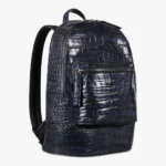 Blue alligator leather backpack with distinctive scaled texture and multiple compartments
