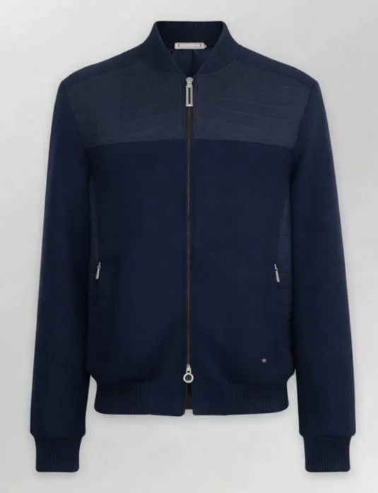 Blue crocodile bomber jacket with cashmere and nubuck leather construction displayed on neutral background