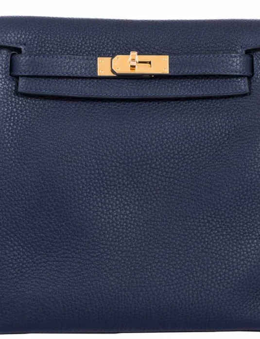 Blue togo leather backpack with gold hardware and Kelly Ado design showing front closure detail