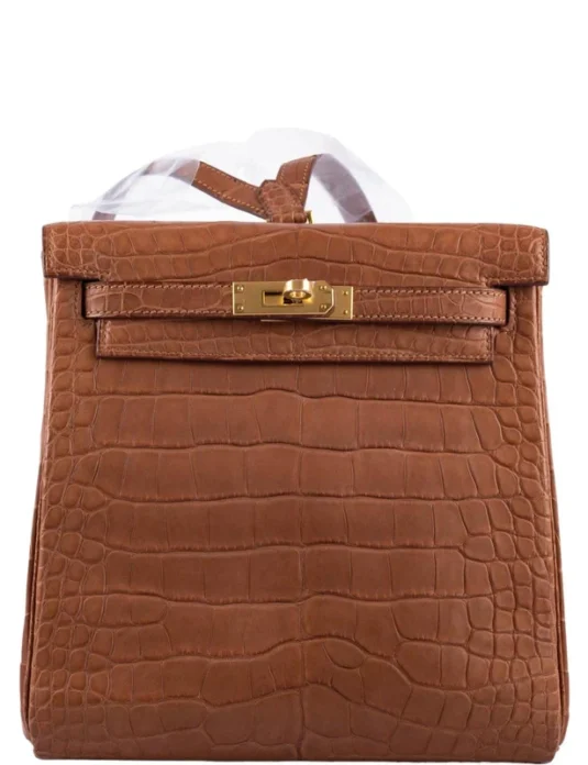 Brown alligator backpack with crocodile leather texture and gold hardware turn-lock closure