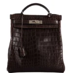Brown crocodile backpack Kelly Ado with structured design and turn-lock closure