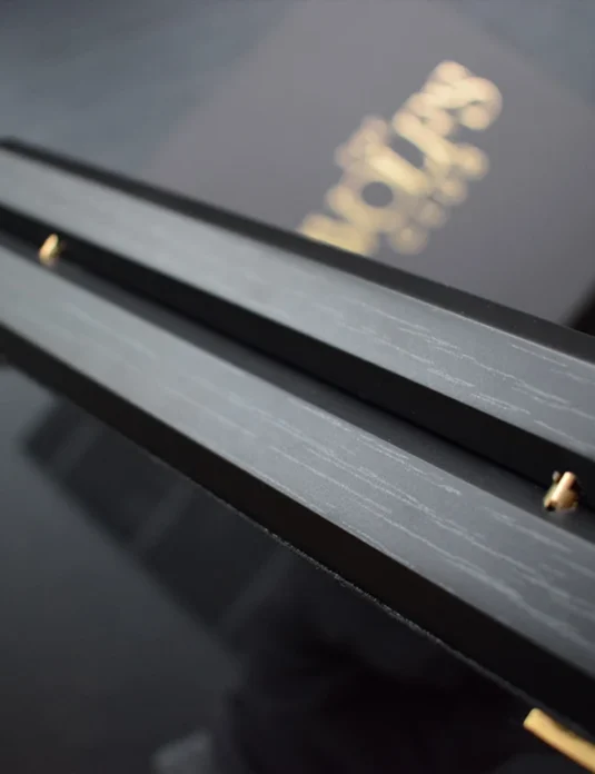 Custom wooden packaging box with sleek design and metal accents showing precision craftsmanship