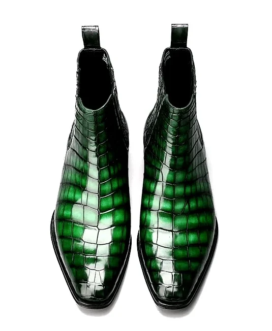 Green alligator leather chelsea boots showing scaled texture and pointed toe design