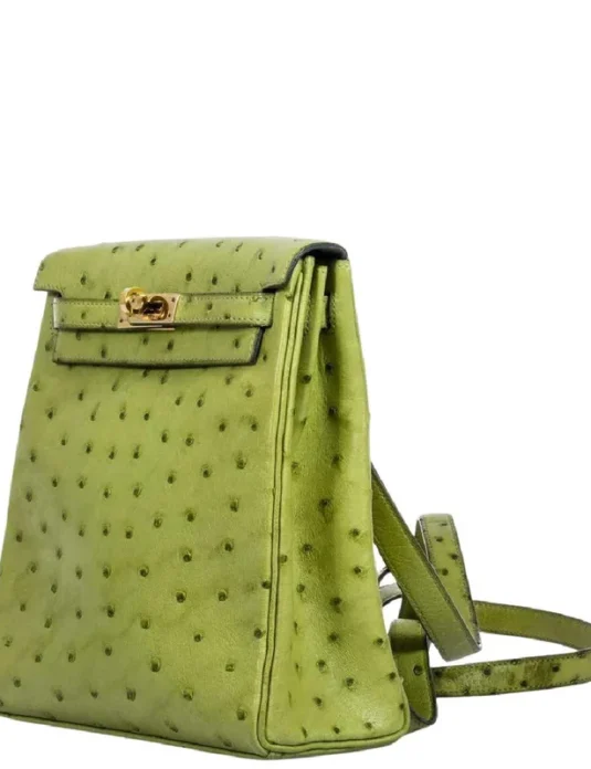 Green ostrich leather backpack with gold hardware showing textured exotic hide and adjustable straps
