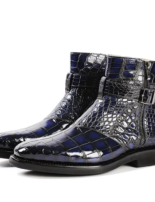 Blue alligator leather boots with lace-up design showing scaled texture and ankle-height construction