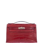 Red crocodile clutch bag Kelly pochette with textured leather scales and top handle
