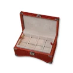Red crocodile watch box with cream interior compartments and metal hardware clasp