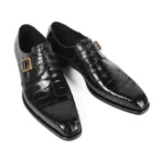 Black crocodile leather monk strap shoes with single buckle and gold hardware