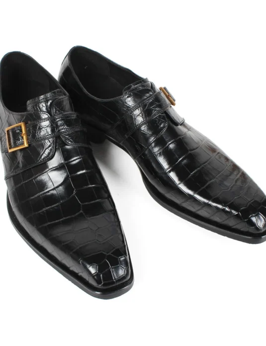 Black crocodile leather monk strap shoes with single buckle and gold hardware