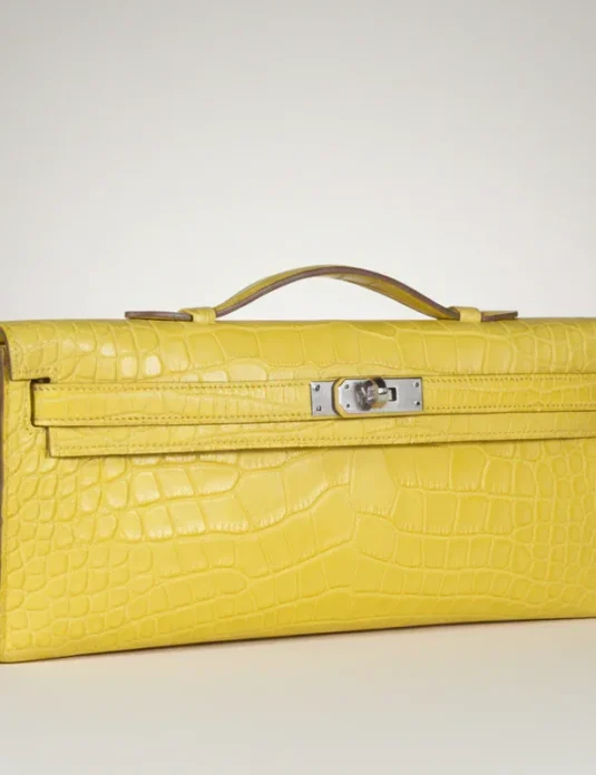 Yellow crocodile leather clutch Kelly style with palladium hardware and top handle
