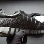 Black crocodile bouncing sneakers