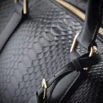 Black python duffle bag