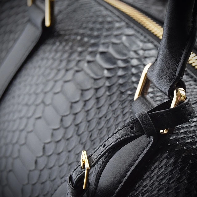 black python duffle bag close up