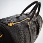 Black python duffle bag