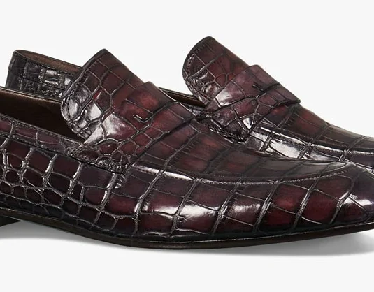 Brown alligator leather loafer with rectangular scale pattern and classic penny loafer design
