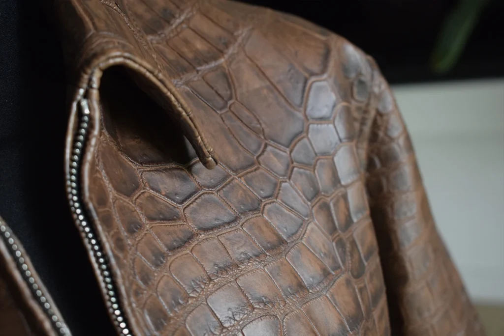 dark brown patina crocodile jacket shoulder