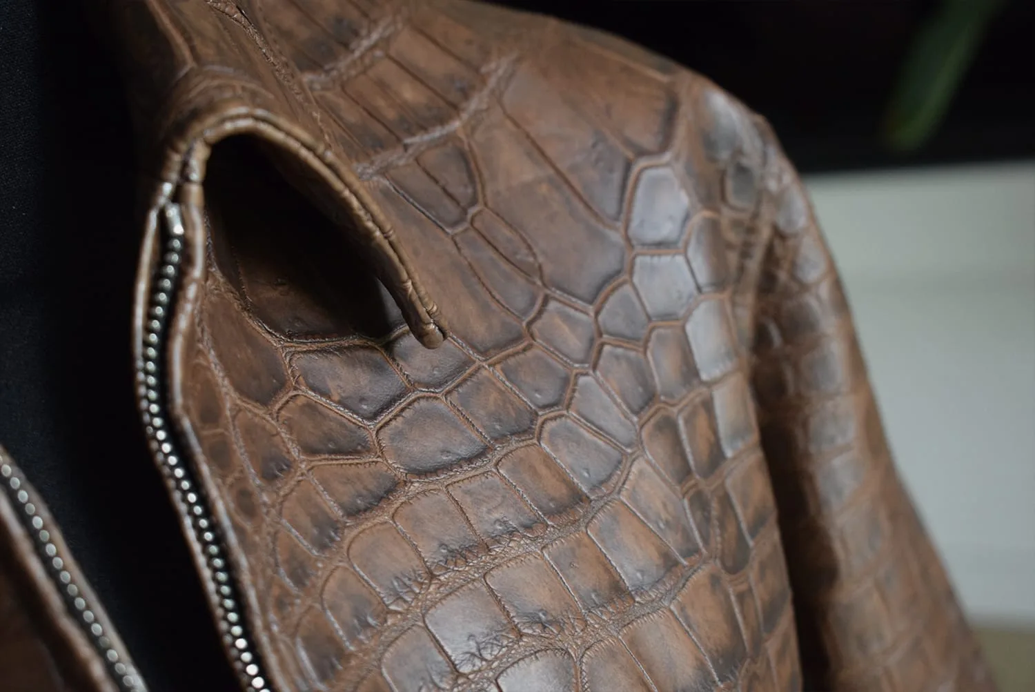 dark brown patina crocodile jacket shoulder