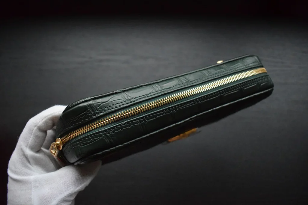 pochette crocodile vert fermeture éclair dorée