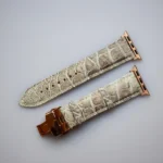 Himalayan crocodile apple watch band with rose gold butterfly clasp showing natural beige leather texture