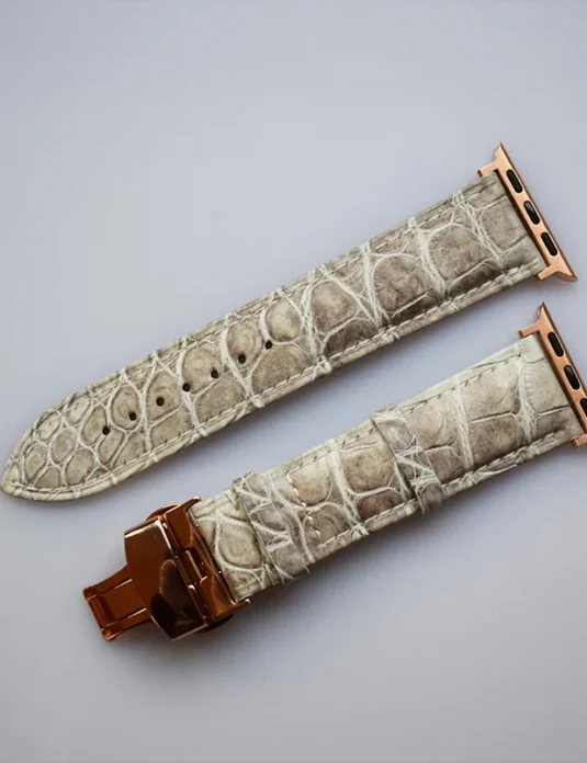 Himalayan crocodile apple watch band with rose gold butterfly clasp showing natural beige leather texture