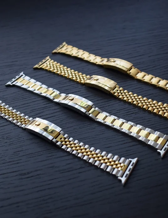 劳力士金表带系列，展示四款采用金色饰面的奢华金属表带。