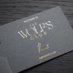 Custom leather card slider in gray with gold foil embossing and sliding mechanism