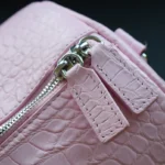 Pink crocodile duffle bag