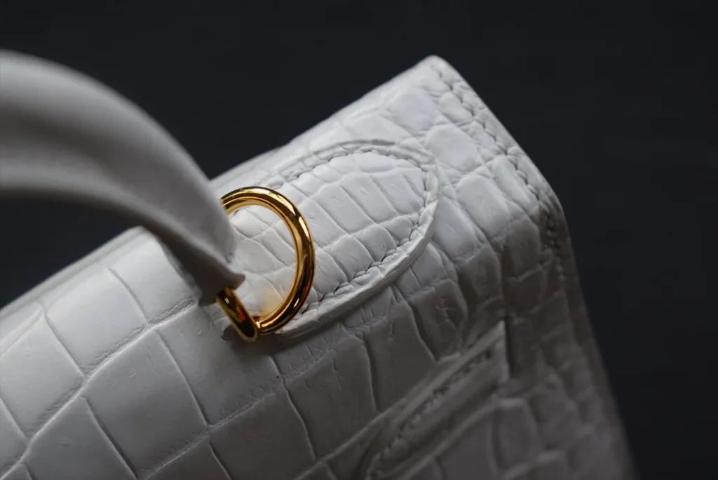 white crocodile kelly handbag close up