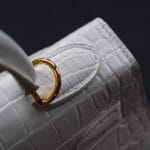 white crocodile kelly handbag close up