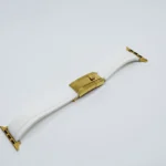 White apple watch band gold with curved leather strap and gold-plated buckle hardware
