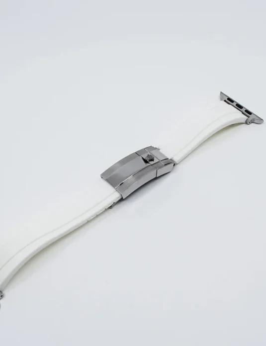 White leather apple watch band with silver hardware and deployant clasp on white background